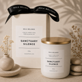 Nula Wellness 'Sanctuary Silence' candle with packaging and decorative elements on a neutral background